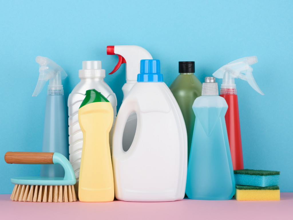 Picture of home cleaning tools, bottles and brushes