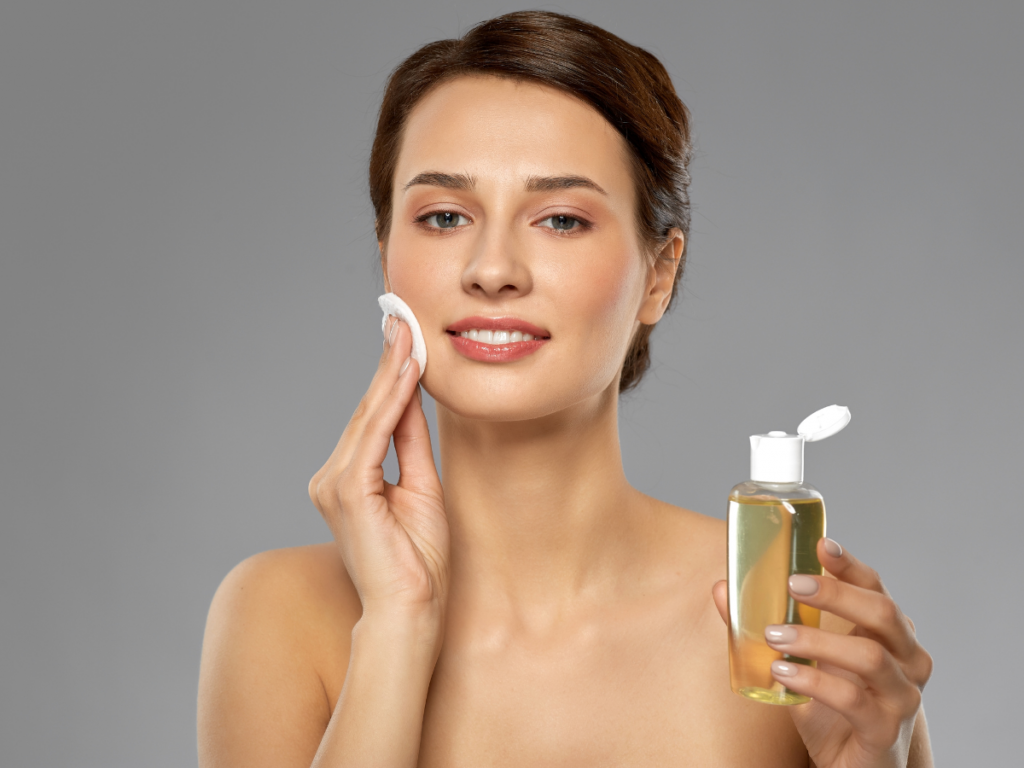 A picture of a woman using a balancing toner. Skincare essentials: Balancing toner