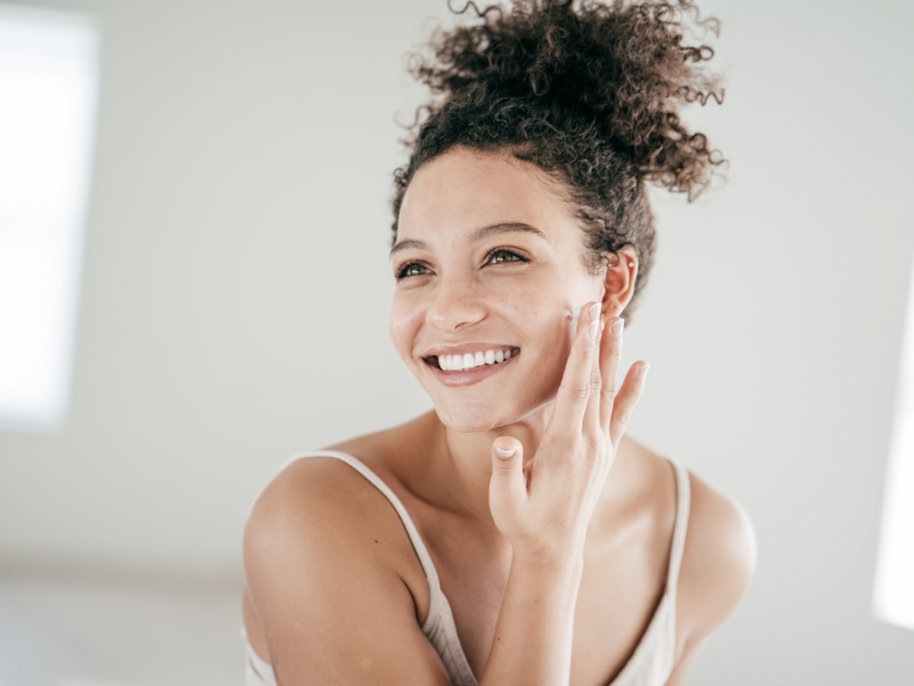 A picture of a woman applying a retinol treatment. Skincare essentials: Retinol Treatment