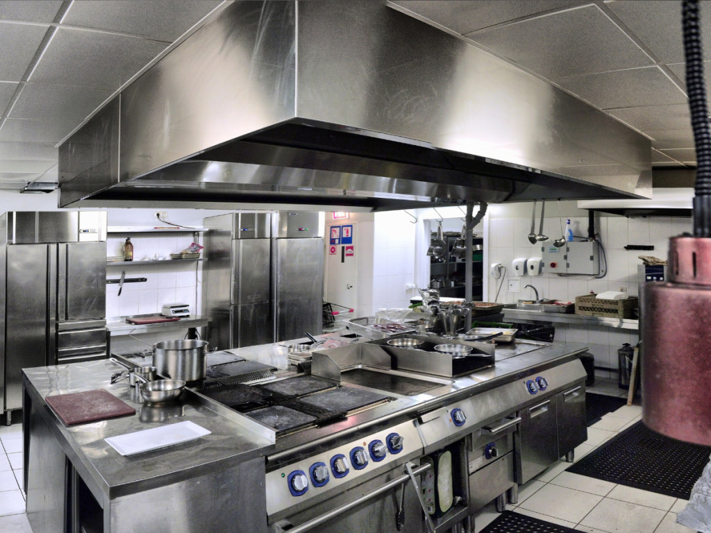 Kitchen Equipment Rental: A picture of professional cooking appliances in a commercial kitchen. 