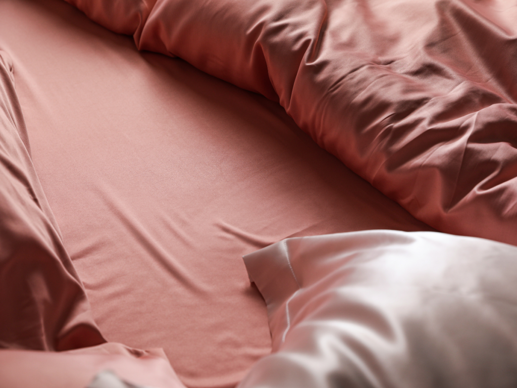 A picture of satin pillowcases and sheets