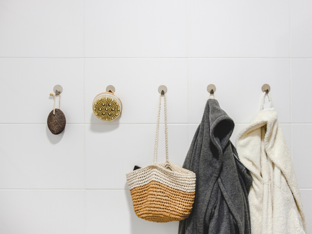 A picture of upgraded bathroom hooks with robes and other accessories